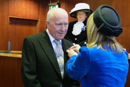 Mr Paul Lucas BEM JP, receiving the British Empire Medal for his services to charity and education